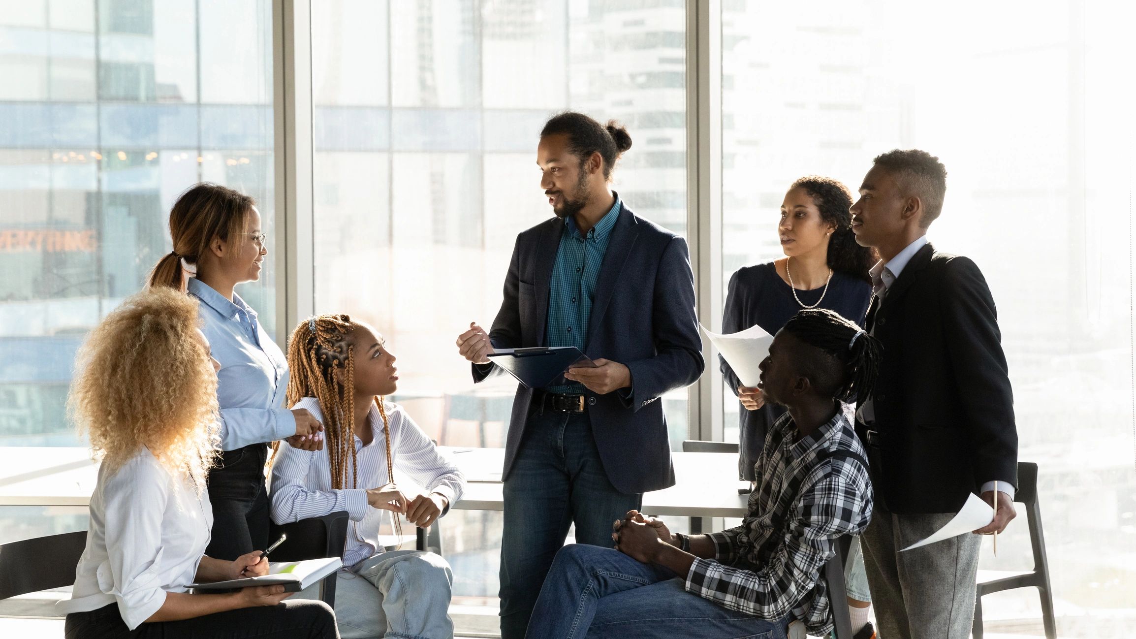 Colleagues collaborating around a table during a planning meeting