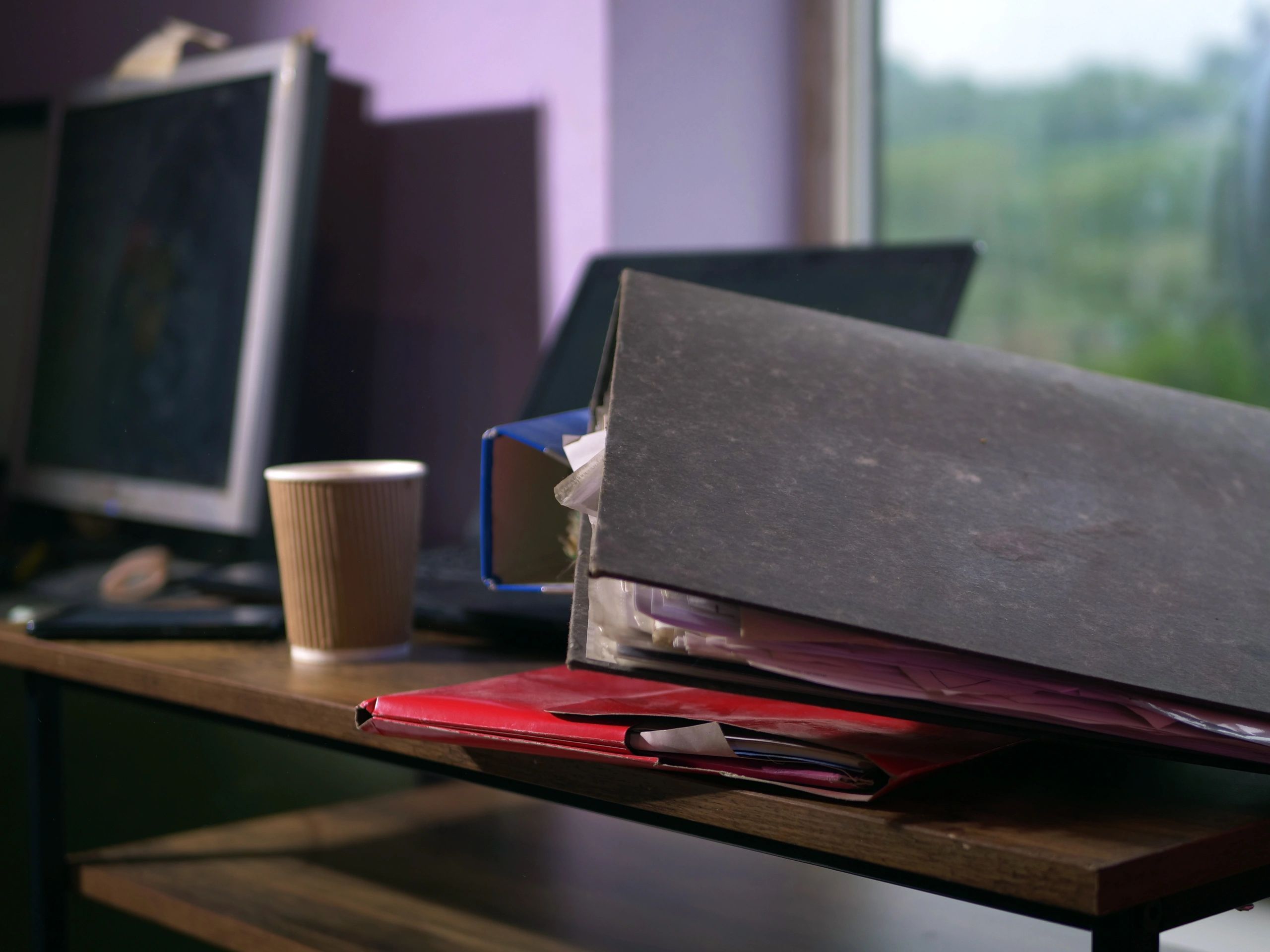 Research files and documents on an office desk
