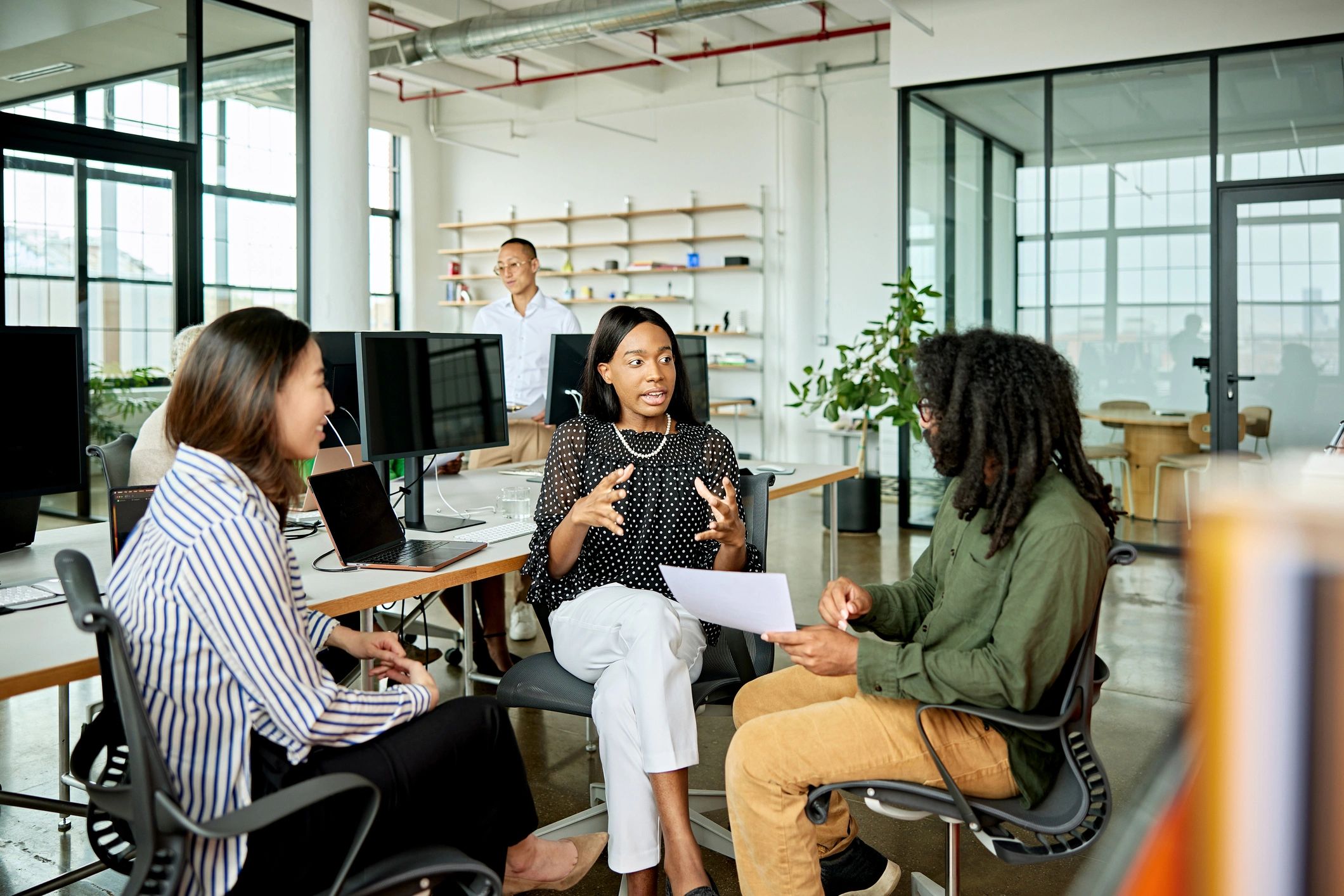 Community-focused team discussion in a collaborative office setting